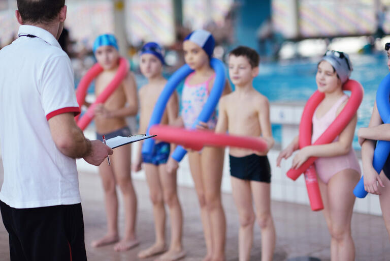 swim lessons coach with students